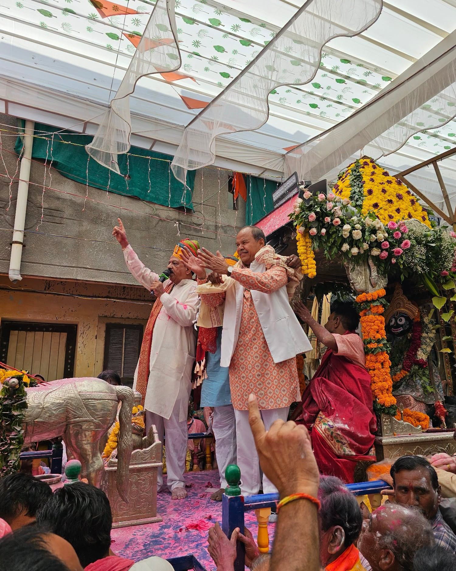 Bharatsinhji Dabhi participating in a Rath Yatra procession with the community