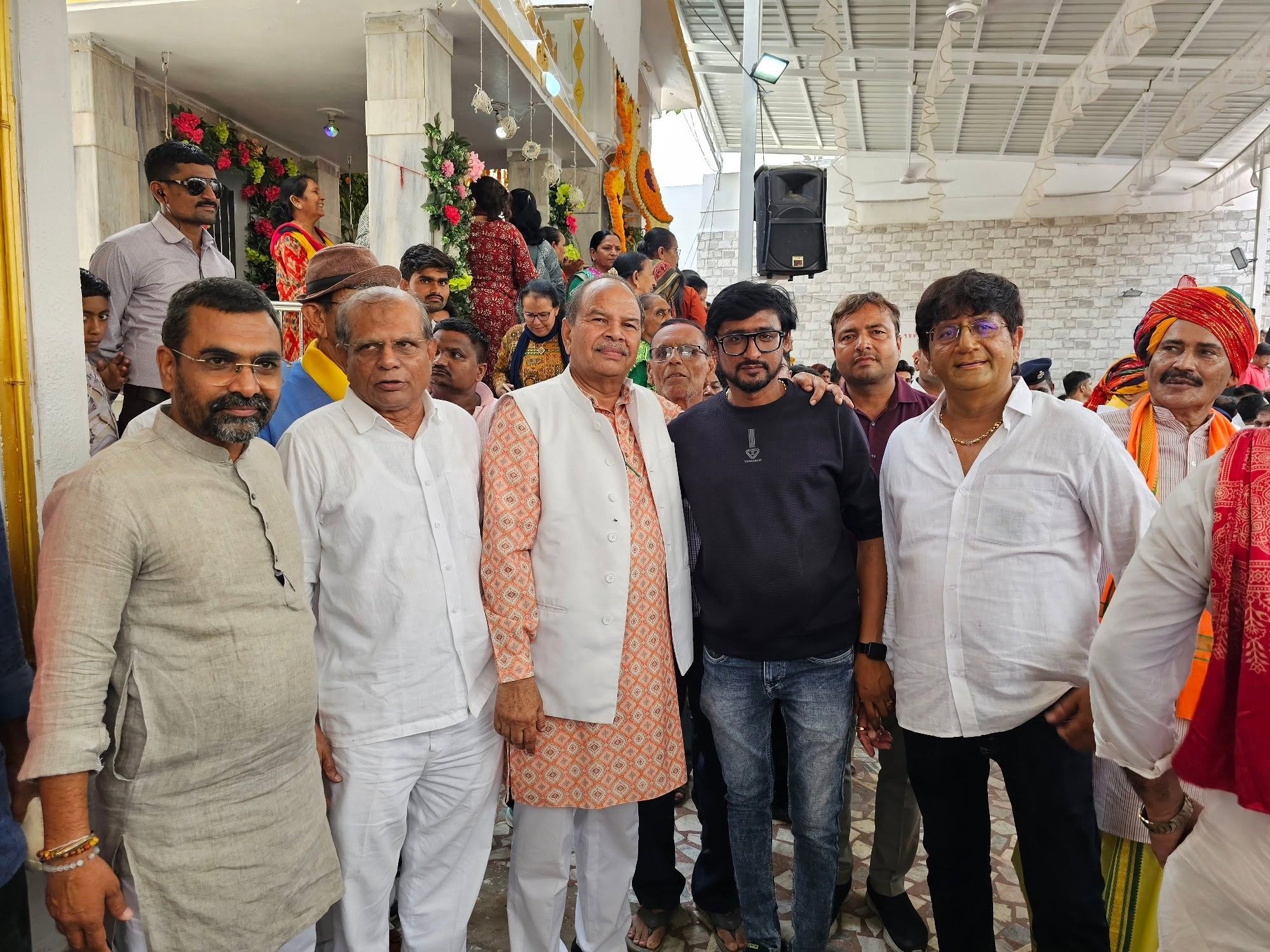Bharatsinhji Dabhi with residents at a temple gathering in the constituency