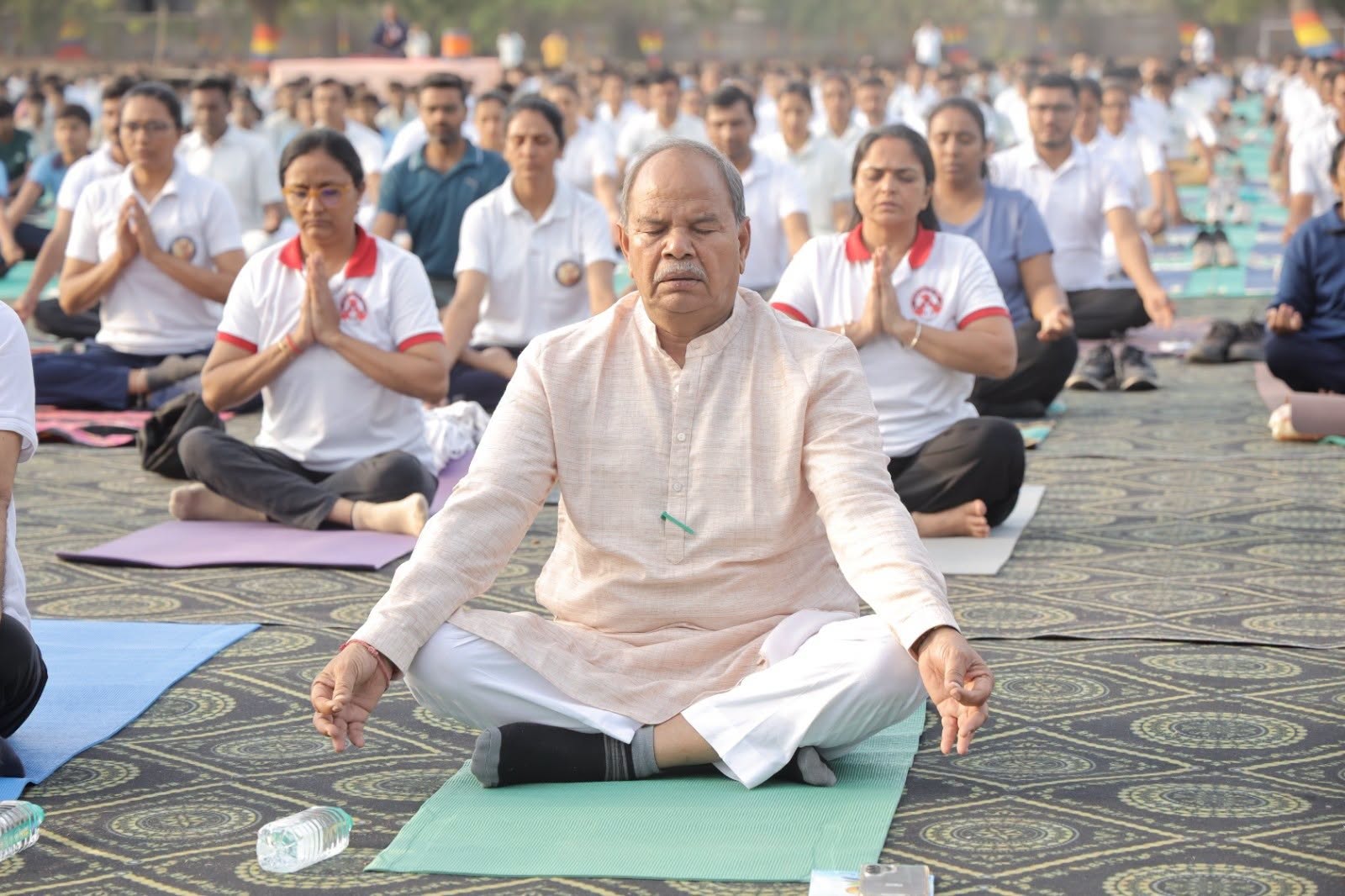 Bharatsinhji Dabhi participating in a mass yoga session on the International Day of Yoga